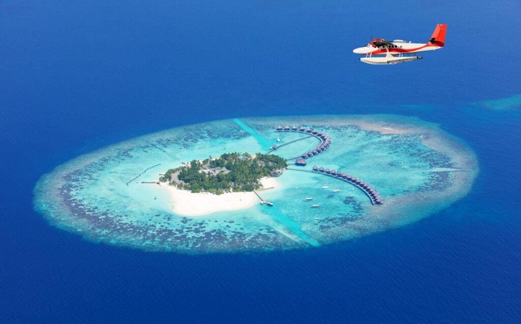 Sea plane flying above Maldives islands