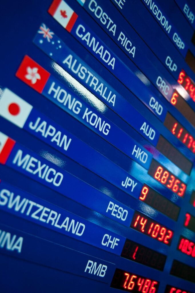 Board showing international exchange rates at airport