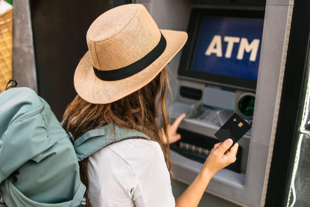 Tourist using ATM
