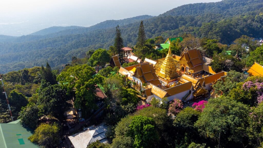 Wat Phra That Doi Suthep temple shining on a mountain peak in Chiang Mai, Thailand