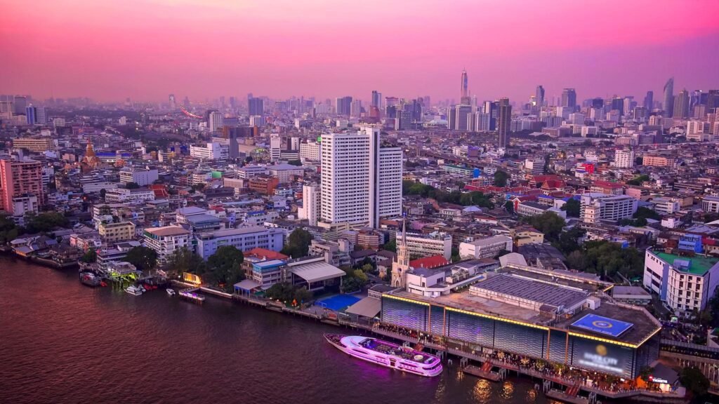 Bangkok Skyline and Chao Phraya River at Sunset in Thailand