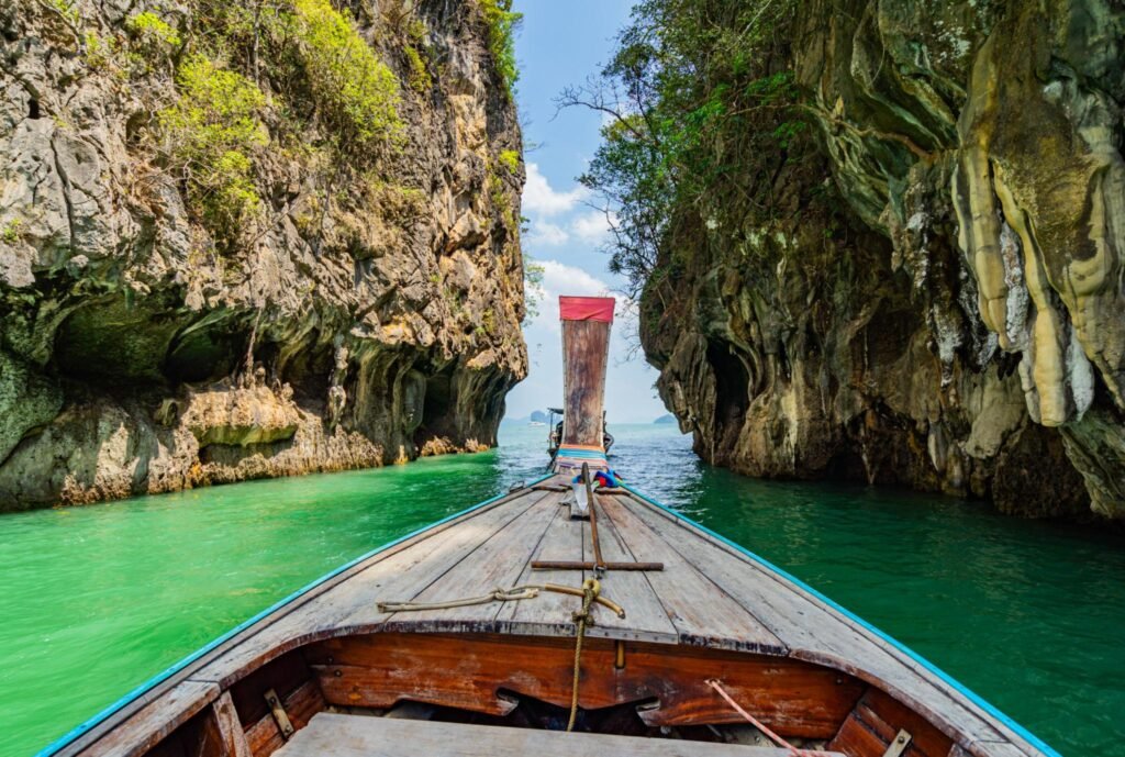 Take a long-tail boat tour to view the islands in the Andaman Sea, Krabi Province, Southern Thailand, Asia sunset over Ao Nang Beach, Krabi, Thailand islands of the sea and boat tourists Longtail boats anchored at the Island in Krabi Province Thailand. Railay Beach Krabi Thailand Coral and islands with beautiful turquoise color sea in Krabi province, Thailand. Take a long-tail boat tour to view the islands in the Andaman Sea, Krabi Province, Southern Thailand, Asia