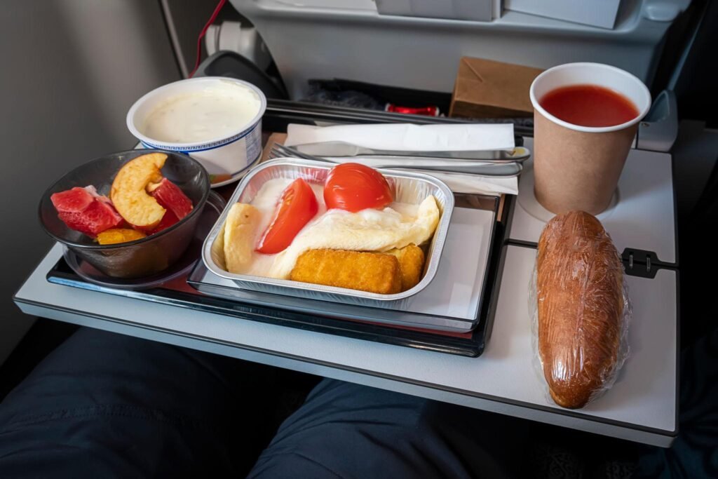 A variety of delicious food on the table in the cabin.. meal in Economy Class. Airlines. for food on the plane. to feed the passengers. food set close-up