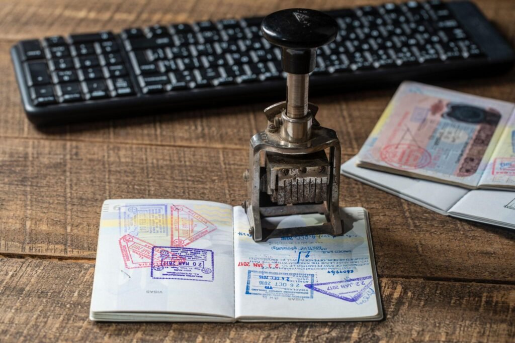 Immigration and passport control at the airport. Border control a stamp in the international passport, closeup. Vacation and travel concept