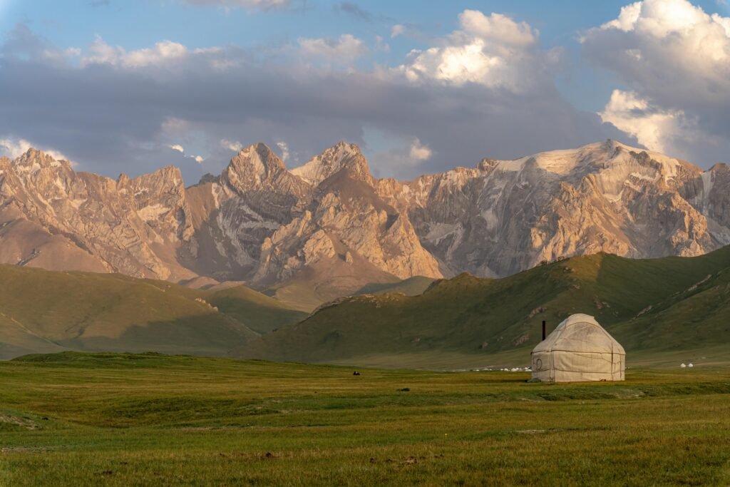 Nomadic Yurt Against the Dramatic Peaks of Ayu Unkur, Kyrgyzstan