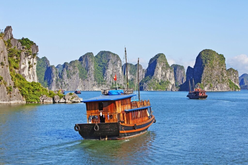 Boats and Rock formations , Ha long Bay