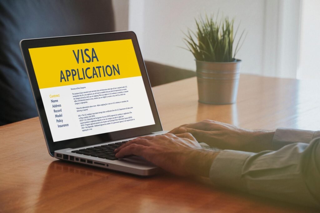 Man doing Visa Application by internet with a laptop.