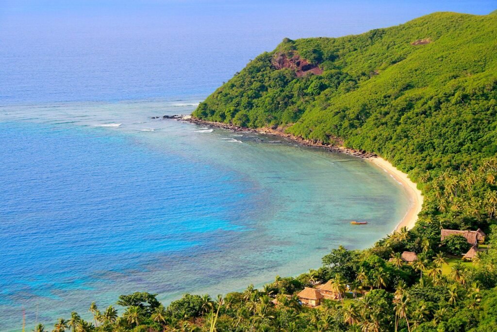Paradise: aerial Fiji Yasawa islands, turquoise beach and bungalow palapas