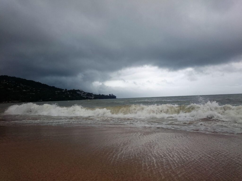 A picturesque and exciting blue sea in Phuket in Thailand. Wide angle shot travel thailand in low season / Rainy season south of thailand Railay beach at Krabi thailand The beautiful natural waterfalls During the rainy season to winter A picturesque and exciting blue sea in Phuket in Thailand.