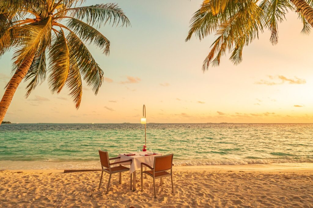Enjoy romantic candlelight dinner on the tropical beach during sunset