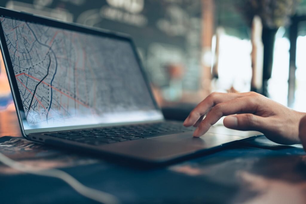 Travelers planning trips and use laptop to book hotels, buy plane tickets, search map, or find travel routes. Travel concept.