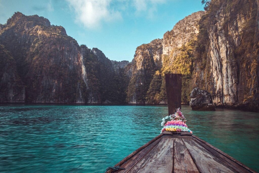 Tourists take a boat to see the islands near Phi Phi Island in Thailand