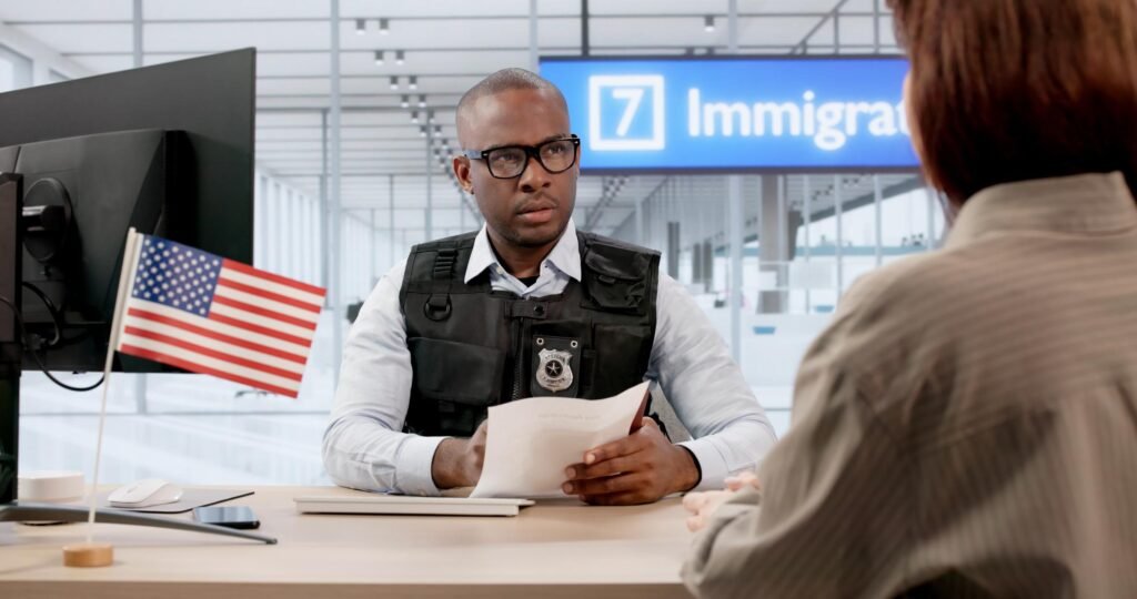Woman Waits Anxiously At Airport While Immigration Agent Checks Passport