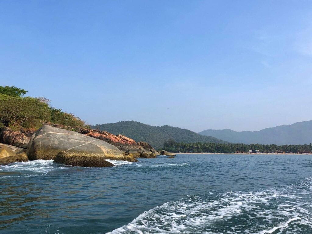 Image from dolphin spotting cruise at Palolem Beach / Butterfly Beach, Goa, India, splashing with blue sea and sky, tropical island paradise