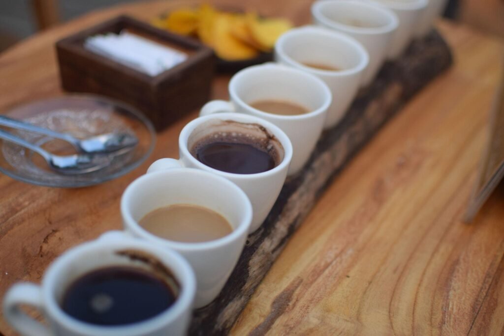 Seven kind of coffee on a wooden tray, including Kopi Luwak, the traditional balinese coffee