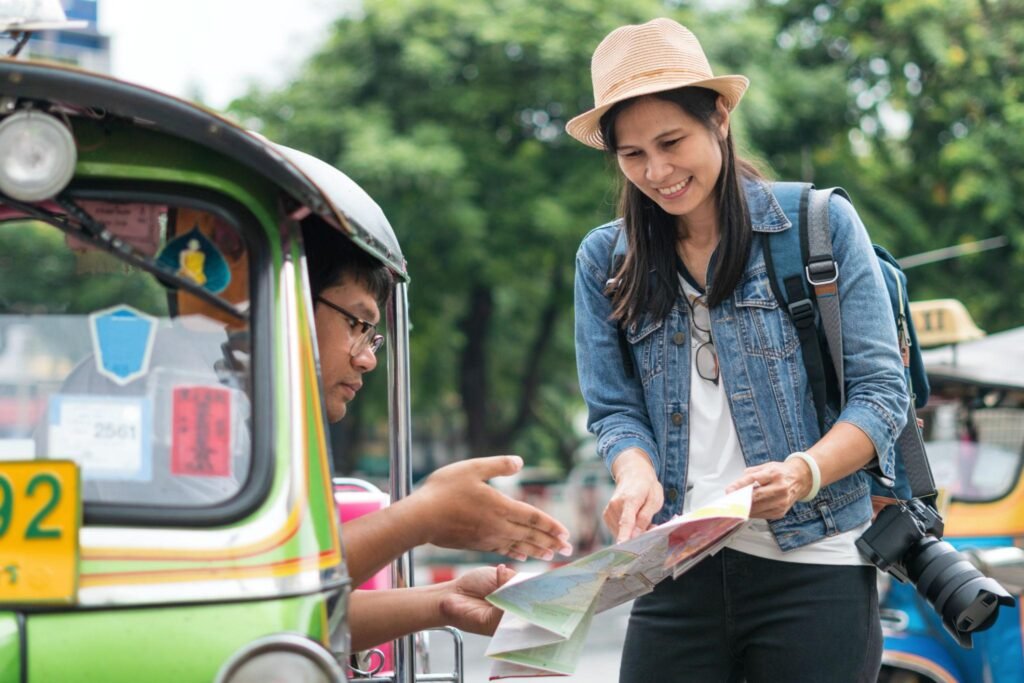 Woman asking places in Bangkok during traveling her holiday
