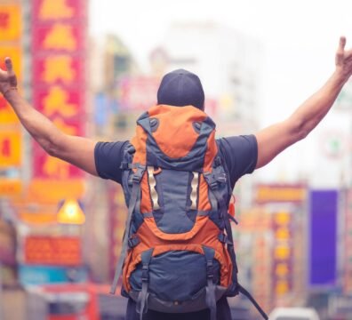 tourist backpacker visiting a city in southeast asia . .