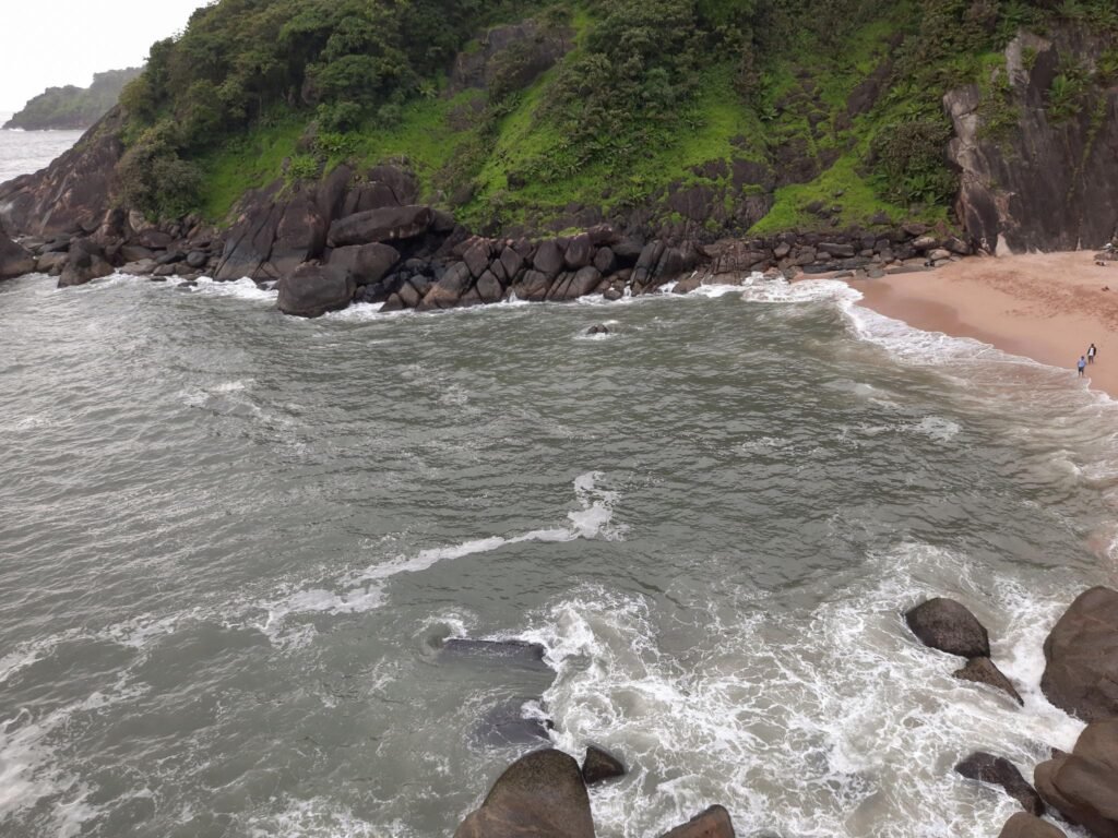 hidden beach in forest. wave on beach. butterfly beach in goa.