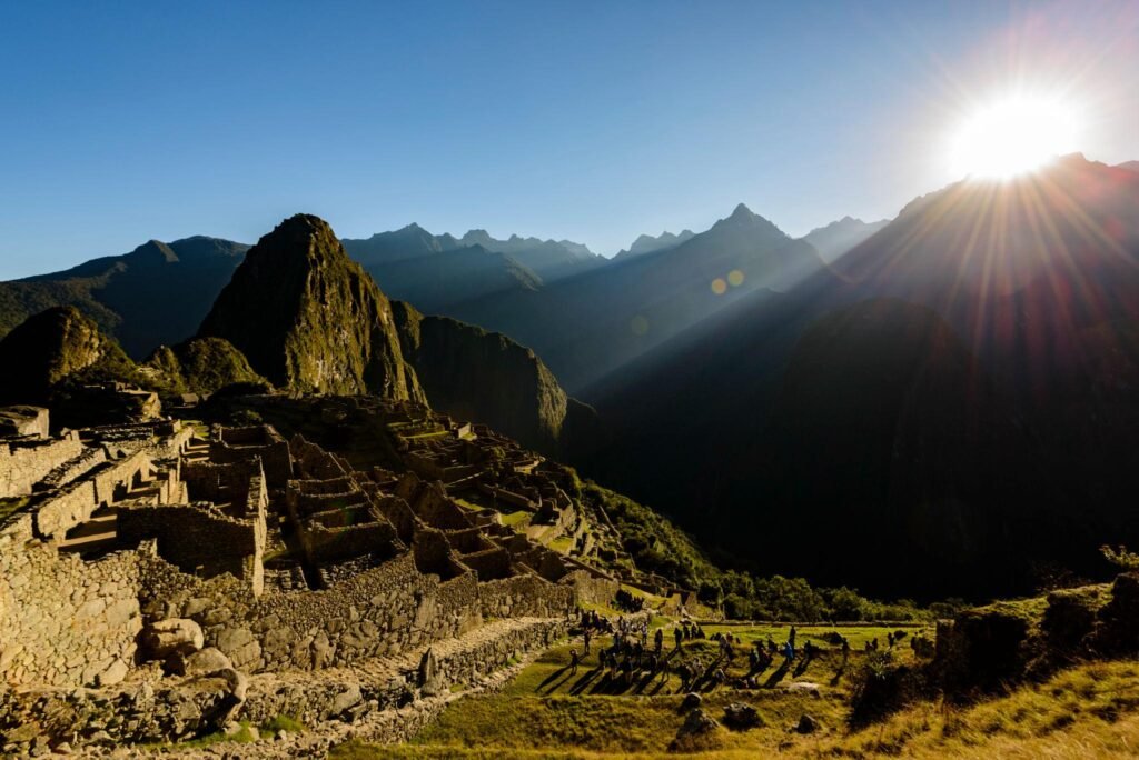 Sun rising over the mountains at Machu Picchu, Peru
