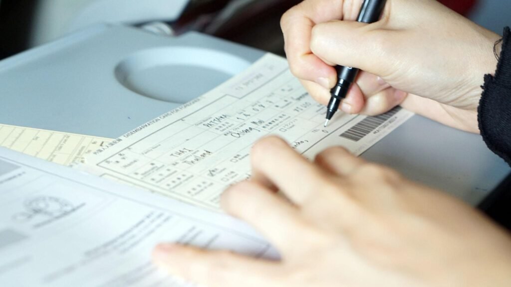 immigration form filling on flight to visit country