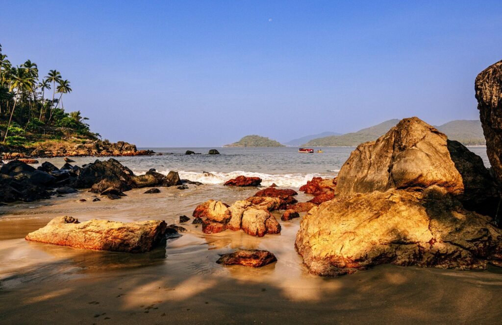 Scenic Tropical Beach with Rock Formations and Calm Waters in Goa, India