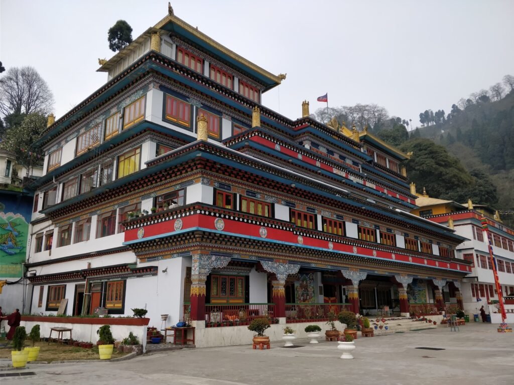 Beautiful Dali Monastery exterior in foggy Darjeeling, India with vibrant architecture.