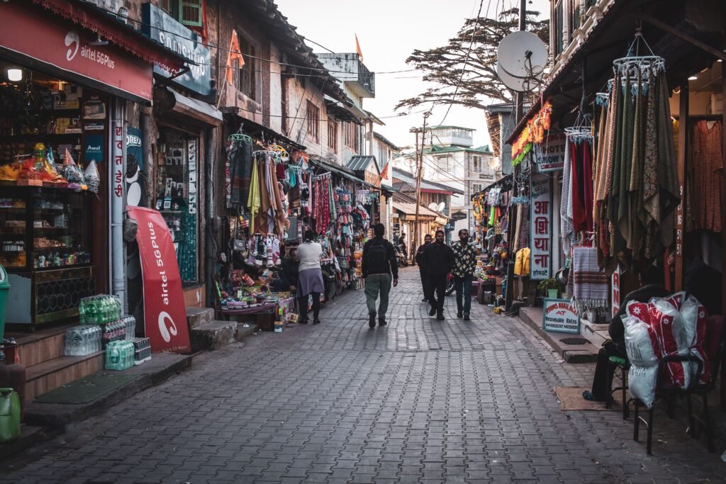 Vibrant Indian market street lined with shops, showcasing local culture and daily life.
