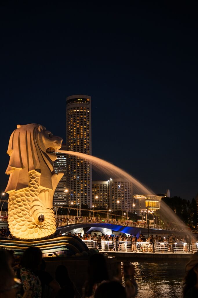 Stunning view of the Merlion statue and Singapore skyline at night.