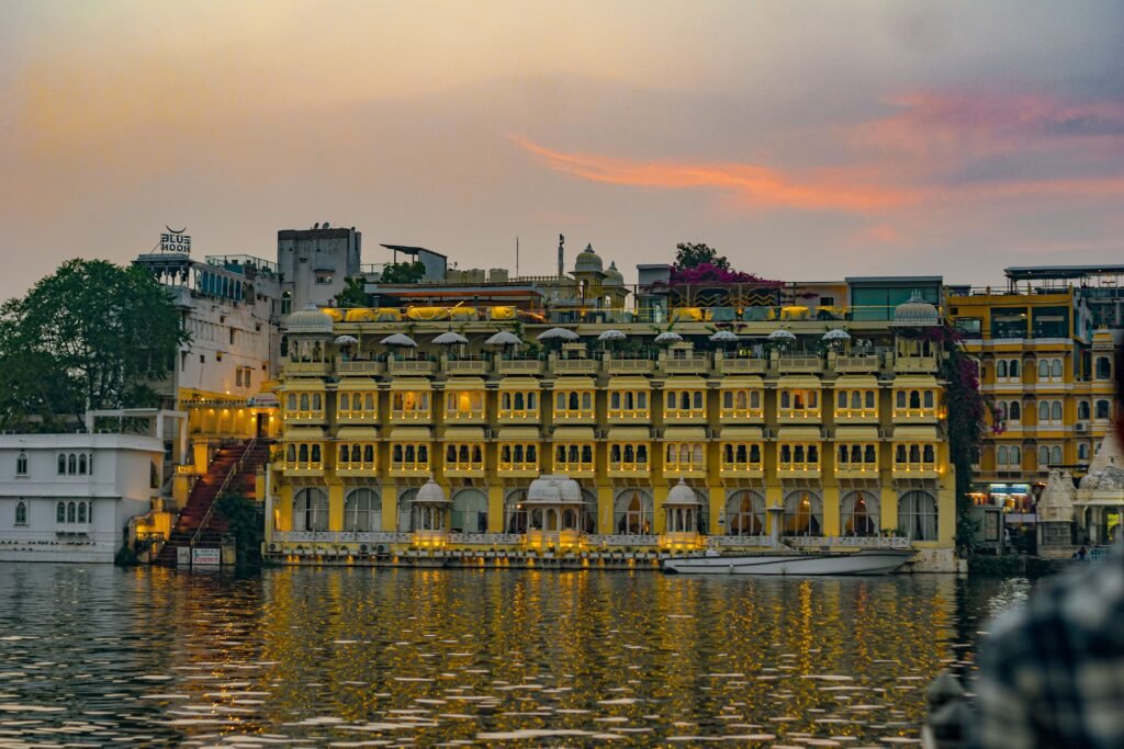 Beautiful architecture on a lake at sunset with a vibrant sky.