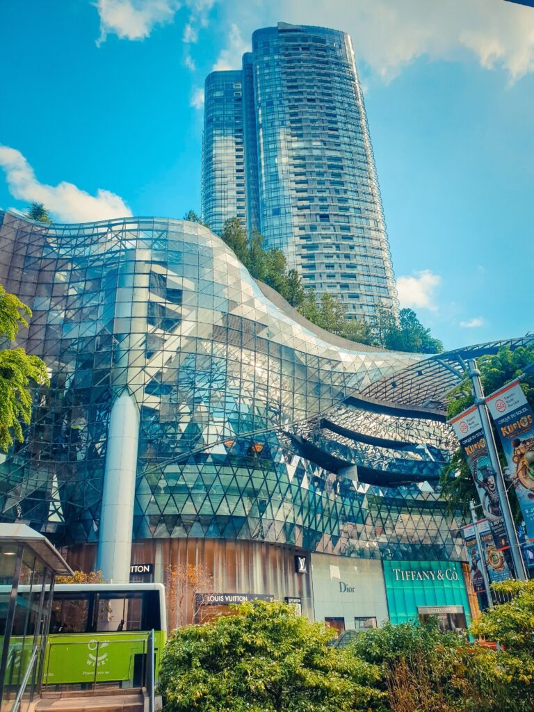 Stunning skyscraper and shopping mall blend seamlessly in city center.