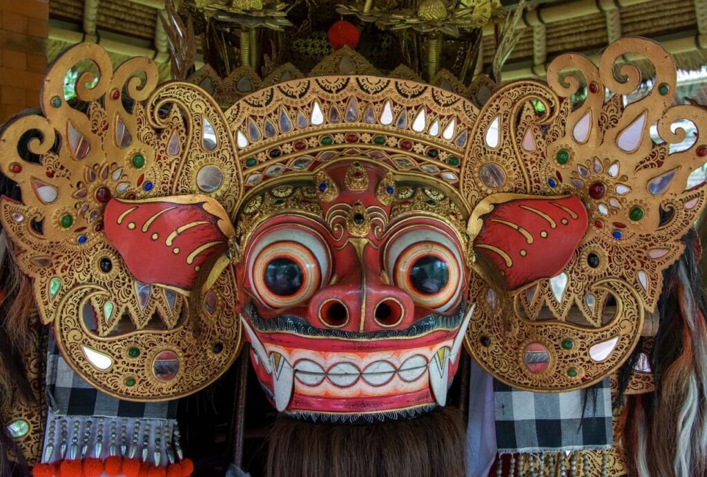 Close-up of a colorful and ornate Barong mask showcasing Balinese artistry and mythology.