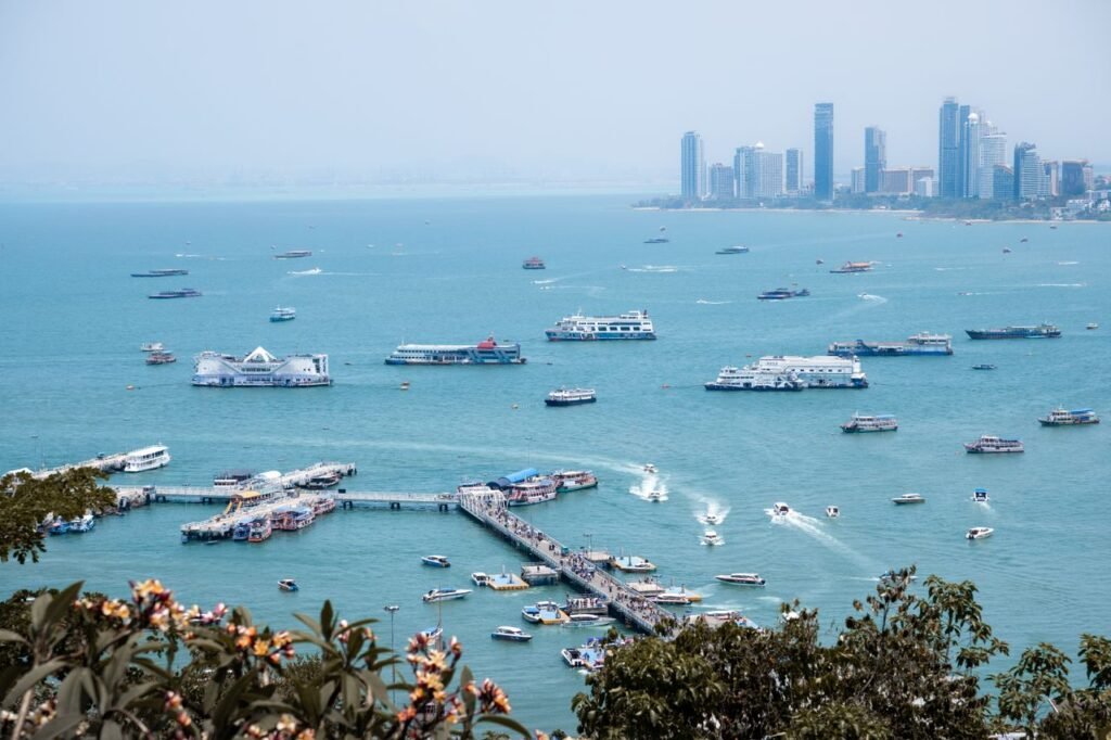 A vibrant harbor scene with boats in Pattaya City, Thailand.