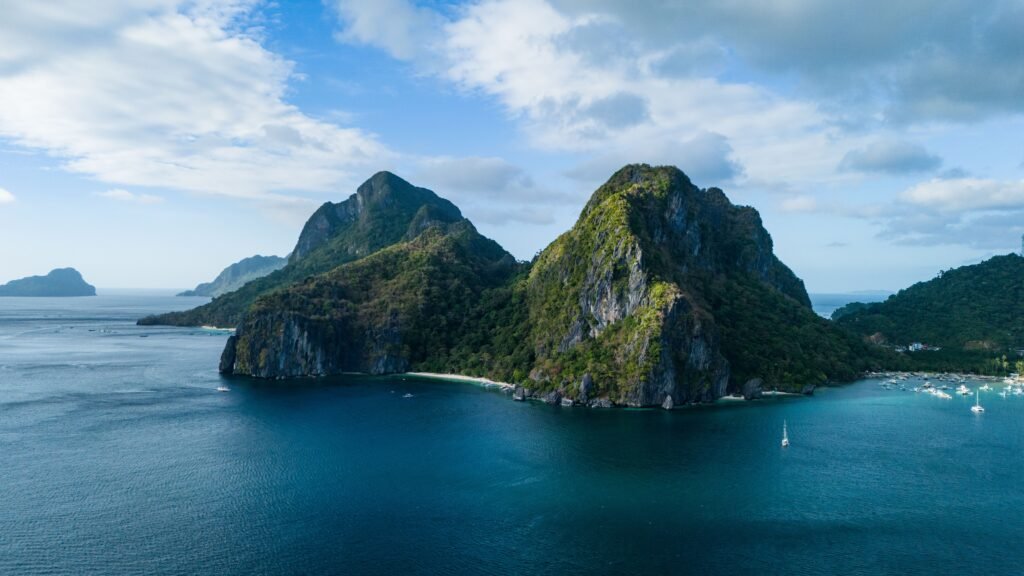 Discover the breathtaking karst landscapes of El Nido, Philippines, with lush islands and azure waters.