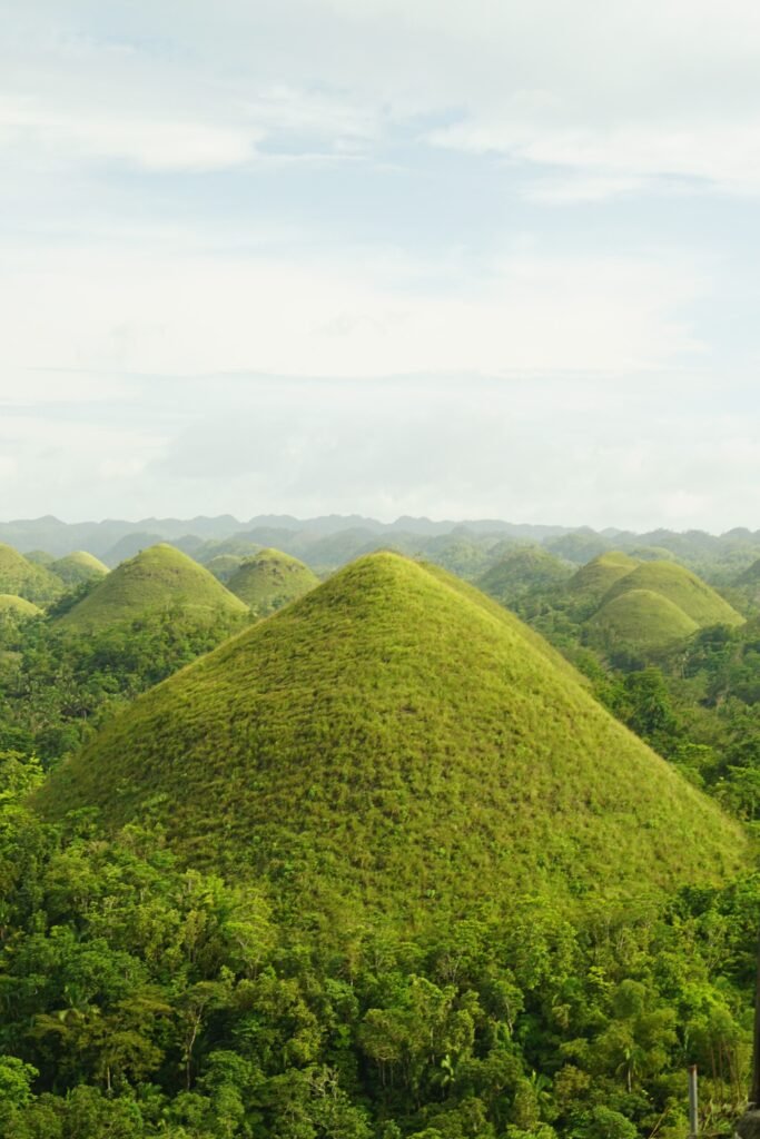 Captivating aerial view of the Chocolate Hills, iconic conical hills in Bohol, Philippines.