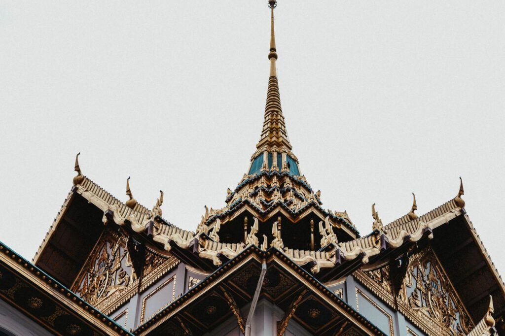 Close-up of an ornate Thai temple roof showcasing intricate traditional architecture.