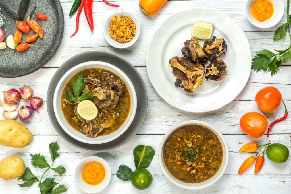 Delicious sop buntut oxtail soup with spices and fresh vegetables in Bali, Indonesia.