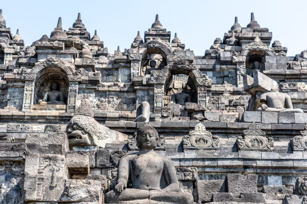 Close-up view of ancient stone sculptures and architecture at Borobudur Temple, Indonesia.