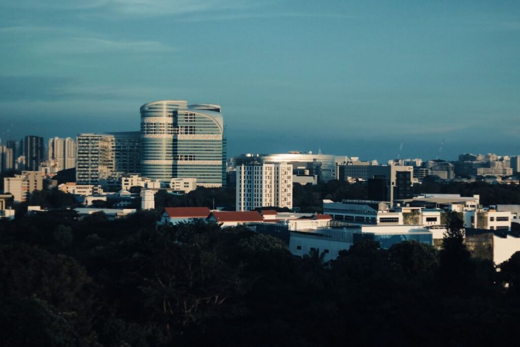 Skyline of Singapore featuring modern architecture under a clear blue sky.