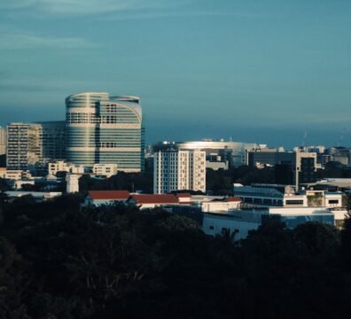 Skyline of Singapore featuring modern architecture under a clear blue sky.