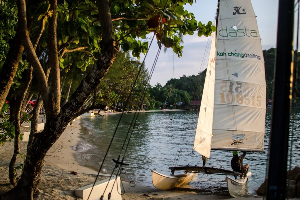 Small sailboat on a serene beach at Koh Chang, Thailand, perfect for a tropical getaway.
