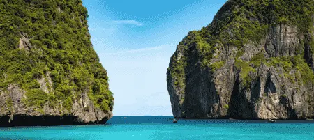 Towering limestone cliffs and crystal-clear turquoise water at Phi Phi Islands, Thailand