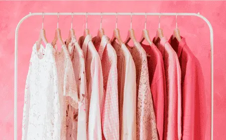 Colorful travel clothing hanging on a clothing rack for packing and vacation outfit planning