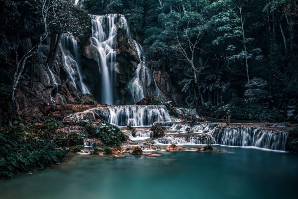 Stunning view of Kuang Si Waterfall in Laos captured in lush green surroundings.