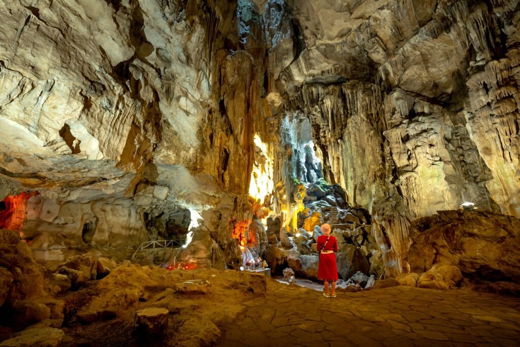 Explore the stunning geological features and rock formations inside a grand cave.