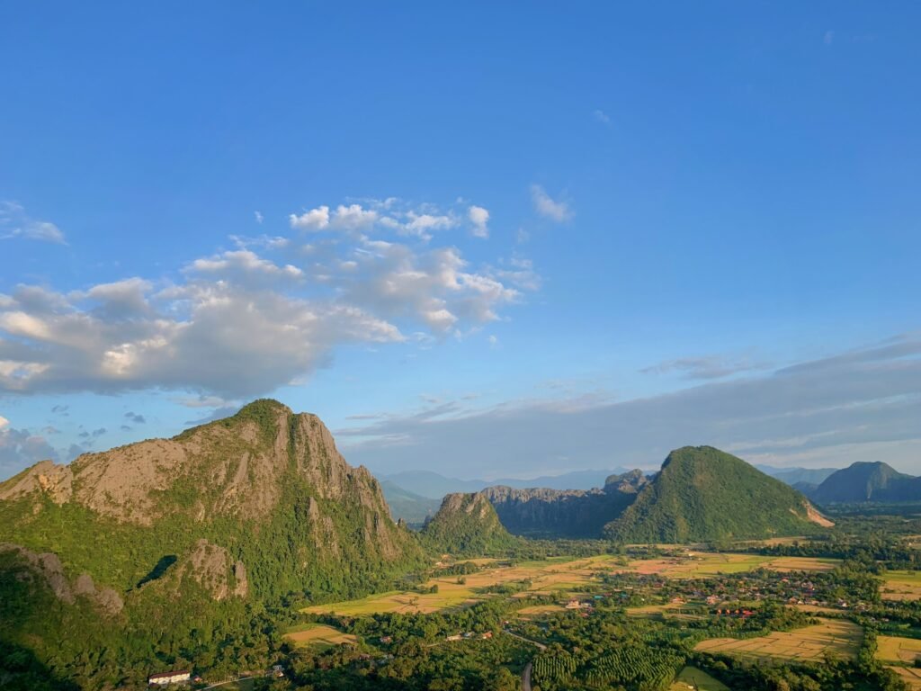 Stunning mountain landscape showcasing green hills and a vast sky, perfect for nature enthusiasts.
