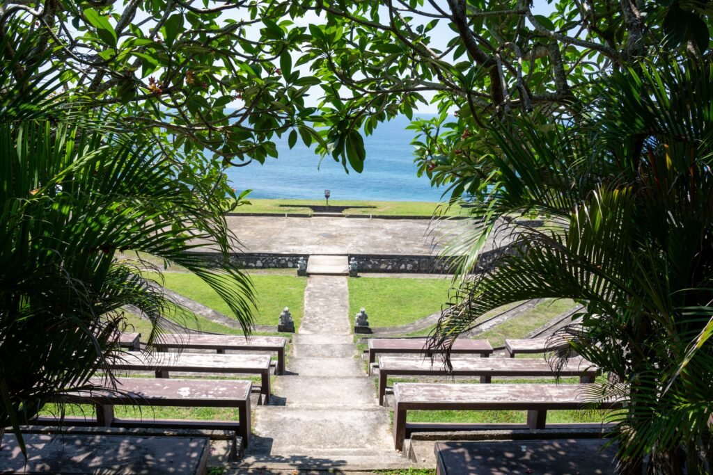 Beautiful amphitheater with ocean view framed by lush greenery in Bali.
