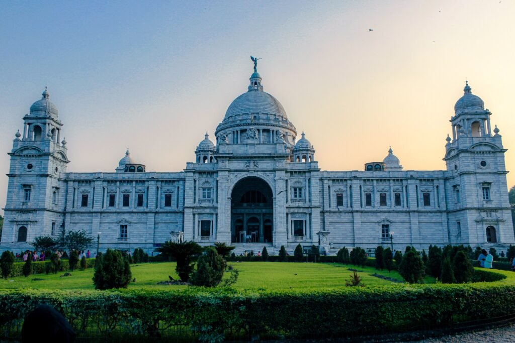 The stunning Victoria Memorial in Kolkata captured at dusk, showcasing its grand architecture.