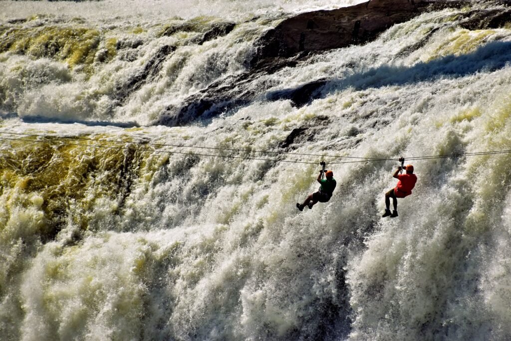 Experience the thrill of ziplining at Montmorency Falls near Québec City, capturing adventure against stunning natural beauty.