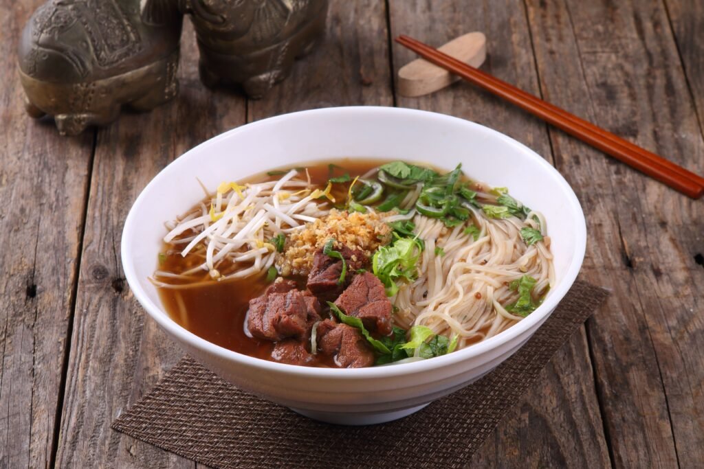 Savor this hearty bowl of Asian pho with beef, rice noodles, and fresh vegetables.