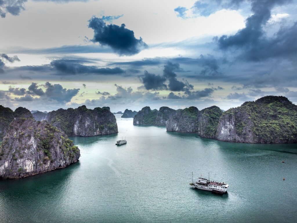 A breathtaking aerial view of boats navigating the scenic waters of Ha Long Bay, Vietnam.